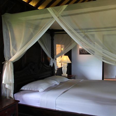 Melanting Cottages มุนดุก ห้อง รูปภาพ